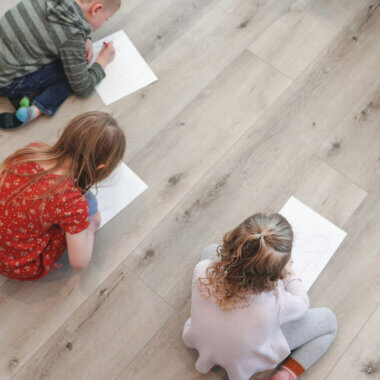 children playing on waterproof luxury vinyl flooring