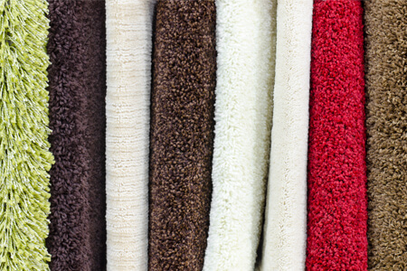 multiple carpet samples in different styles and colors showing the versatility of carpet