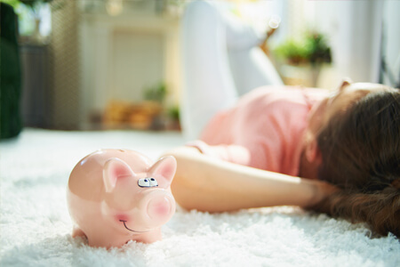 piggy bank on white carpet flooring