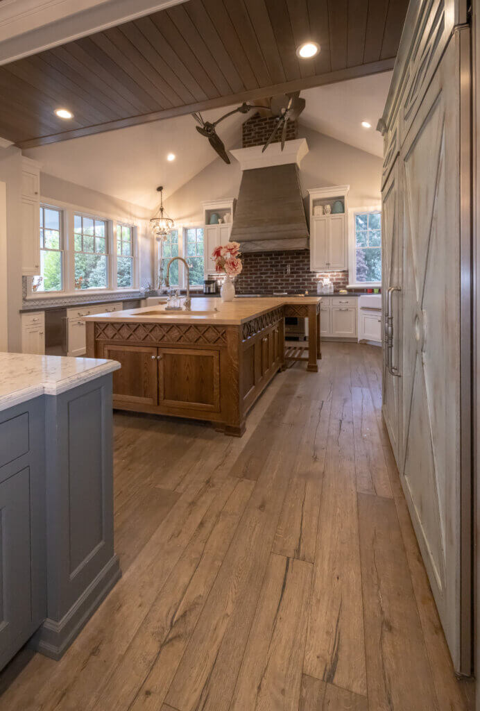 luxury kitchen with dark hard wood flooring and dark cabinets