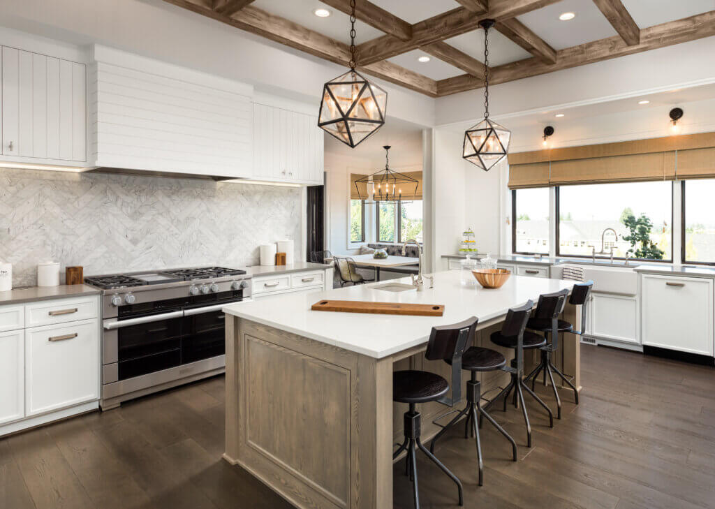 Beautiful kitchen with white cabinets and dark laminate flooring